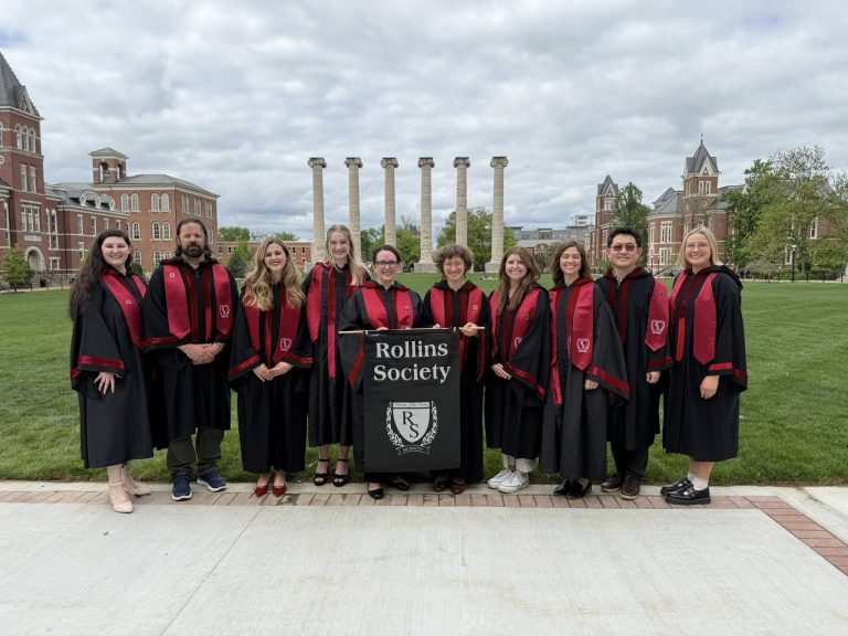 2025 inductees taking picture at columns.